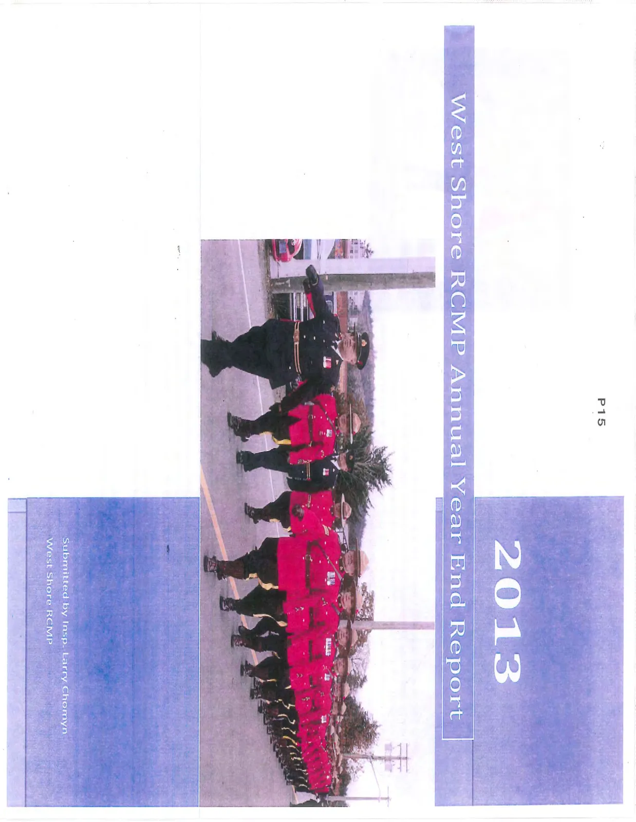 Photo of RCMP officers in red serge and a lead officer in dark uniform marching in a parade.