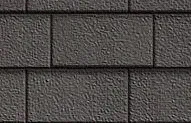 Detail view of dark grey asphalt roof shingles