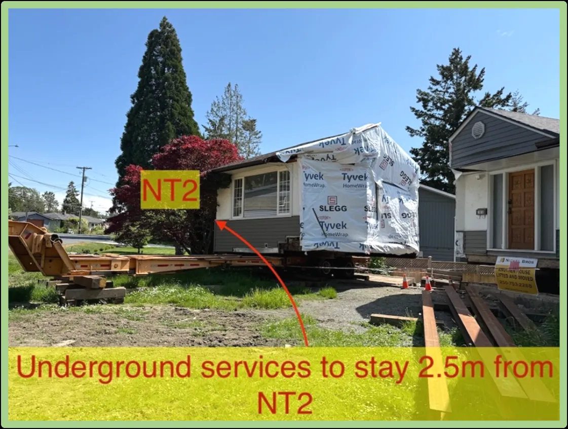 Site photo showing the existing house being moved and the location of tree NT2 with an instruction for underground services