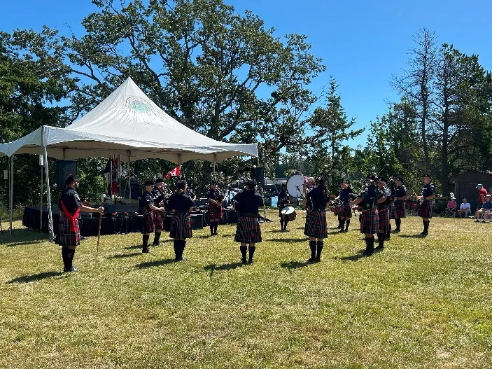 Outdoor entertainment – bagpipe band performing on field