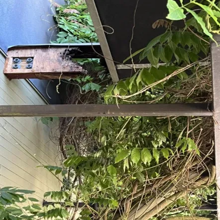 Overhanging Roof Beam – Before, showing structural deterioration