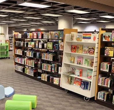 Photo of colorful book displays in a children's section.