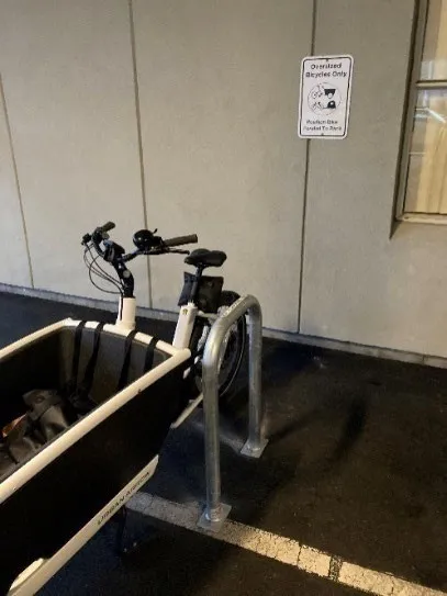 Example of a non-standard bike parking space at Royal Jubilee Hospital featuring an oversized bicycle parked parallel to a rack
