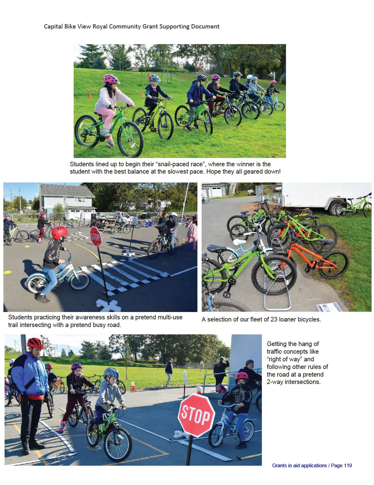Students lined up on bicycles on a grassy field to begin a "snail-paced race"