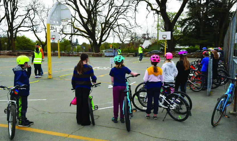 Students line up to quickly review Day 1 classroom material before hopping on their bikes.
