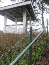 View of a wooden gazebo adjacent to the shoreline path