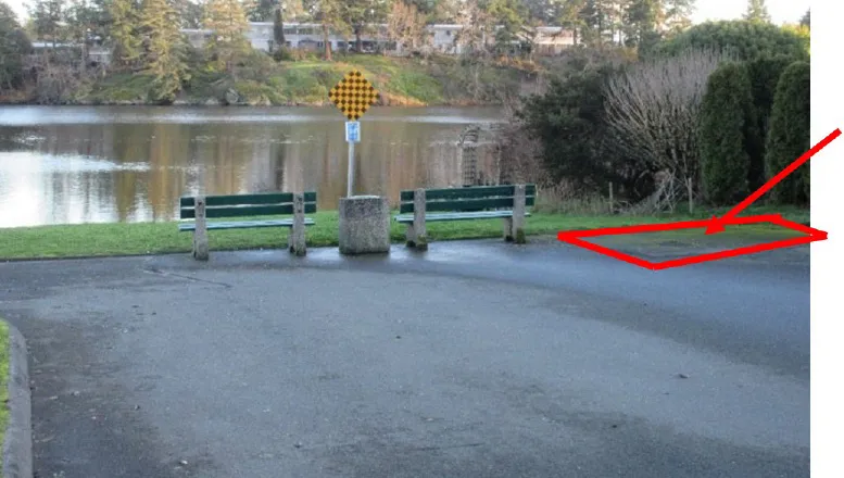 View east at road end showing benches and signage, with a red arrow and callout stating: "Remove existing asphalt & incorporate area into new road end design."