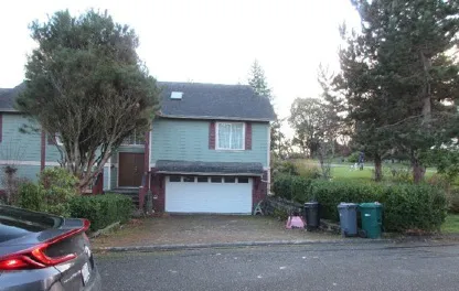 View from parking to south neighbour’s front entry - faces Thomas Park Drive (182 Werra Road)