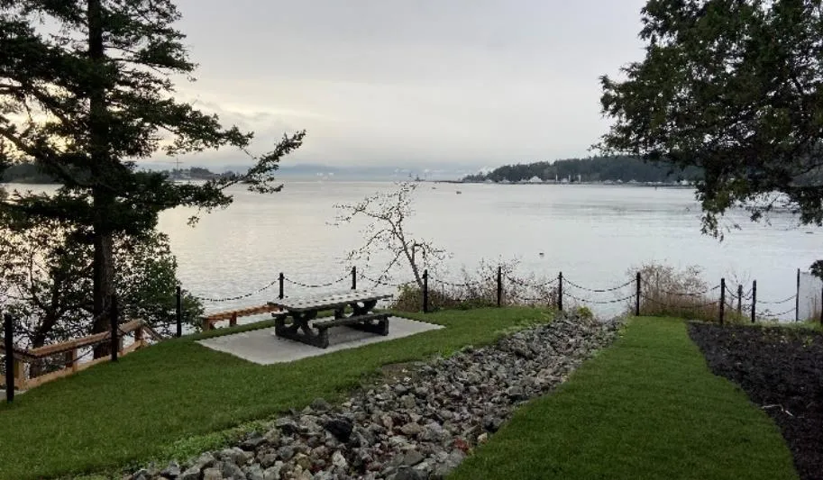 Beaumont Road access improvements featuring a picnic table on a concrete pad overlooking the water