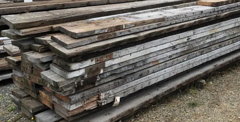 Large stack of salvaged lumber