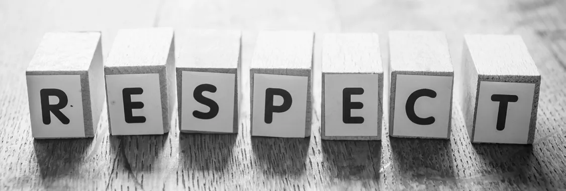 Wooden blocks spelling out the word "RESPECT"