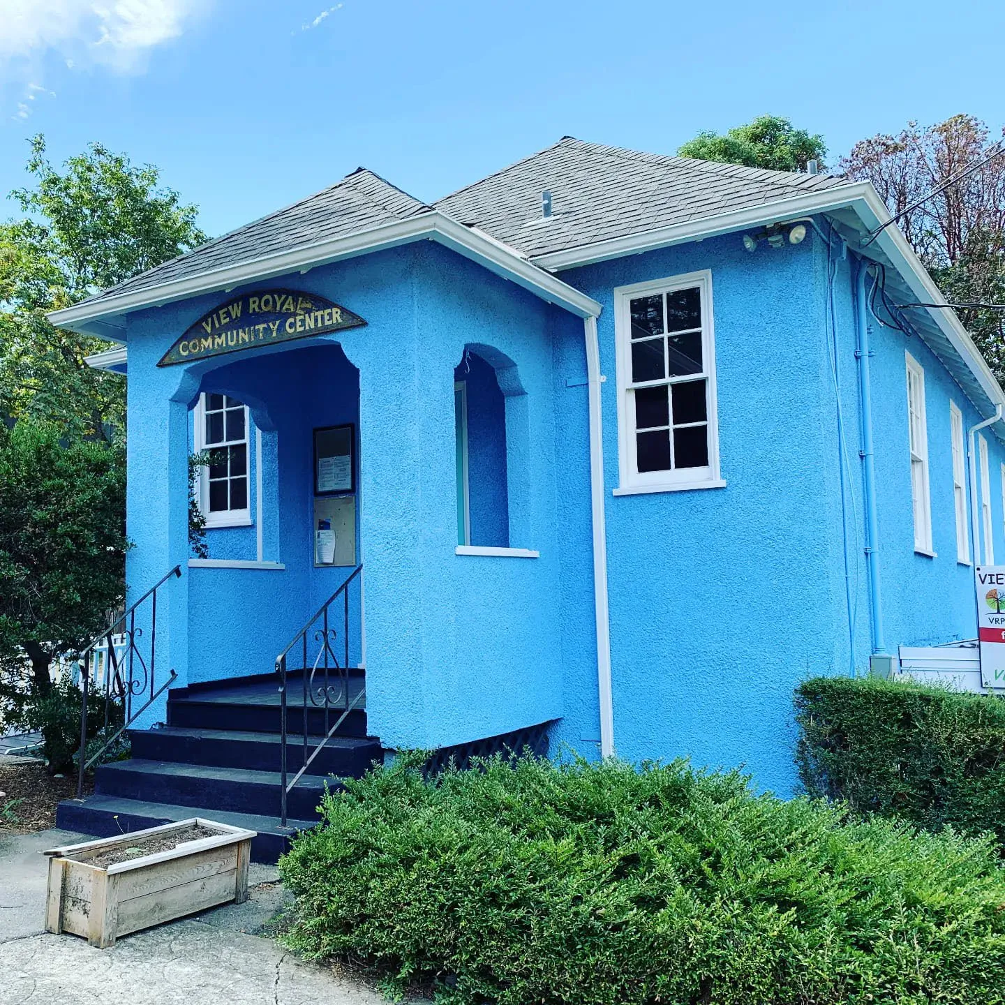 Modern exterior color photograph of the View Royal Community Center building painted bright blue