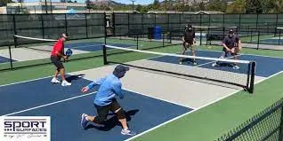 People playing on outdoor pickleball courts