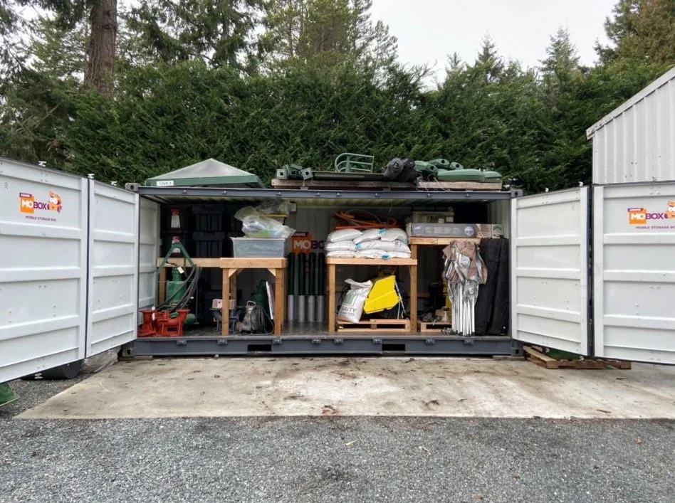 Completed storage container in the Public Works Yard organized with various supplies and equipment