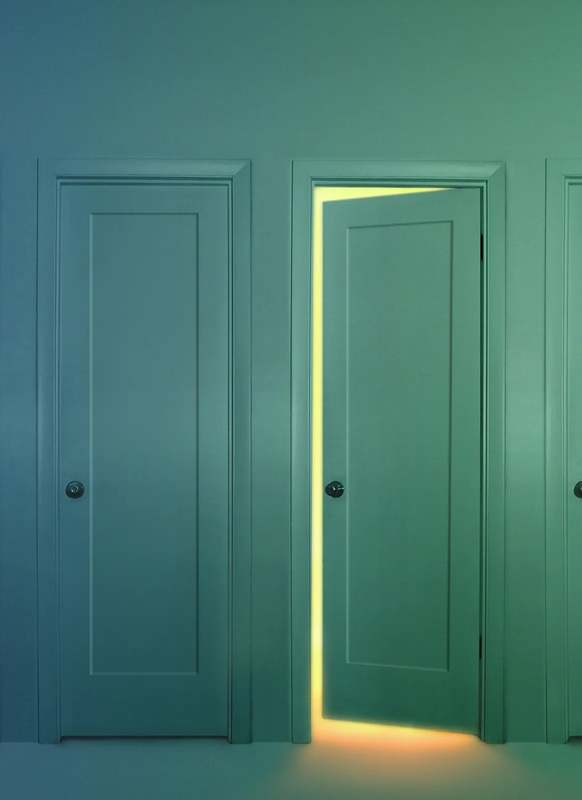 three doors in a row, with the middle door open and glowing with light