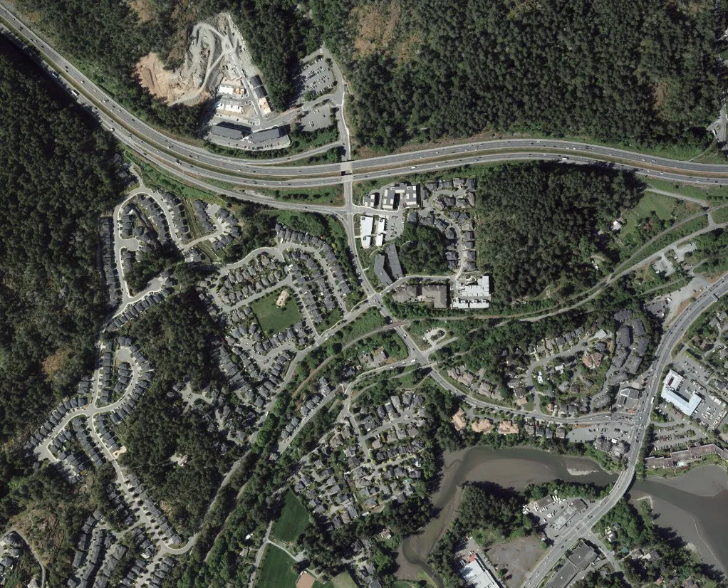 Aerial view of the Thetis Vale residential area showing its proximity to a major highway and surrounding forested areas