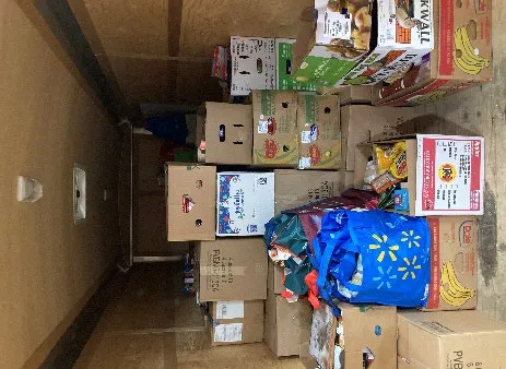 Trailer filled with boxes of food collected during the Santa Drive Around