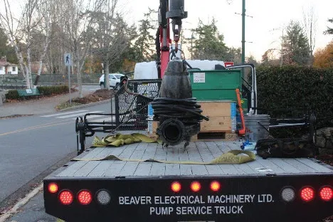 Photo of a pump ready to be rebuilt on the back of a Beaver Electrical Machinery Ltd. pump service truck