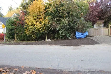 After photo of the culvert replacement site with blue tarps on the ground