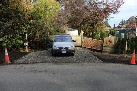 After photo showing a car parked on the newly gravelled driveway surface