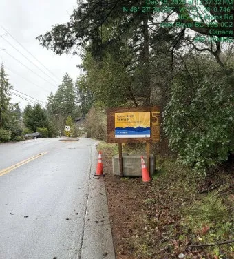 Atkins Road Sidewalk project signage along the roadside