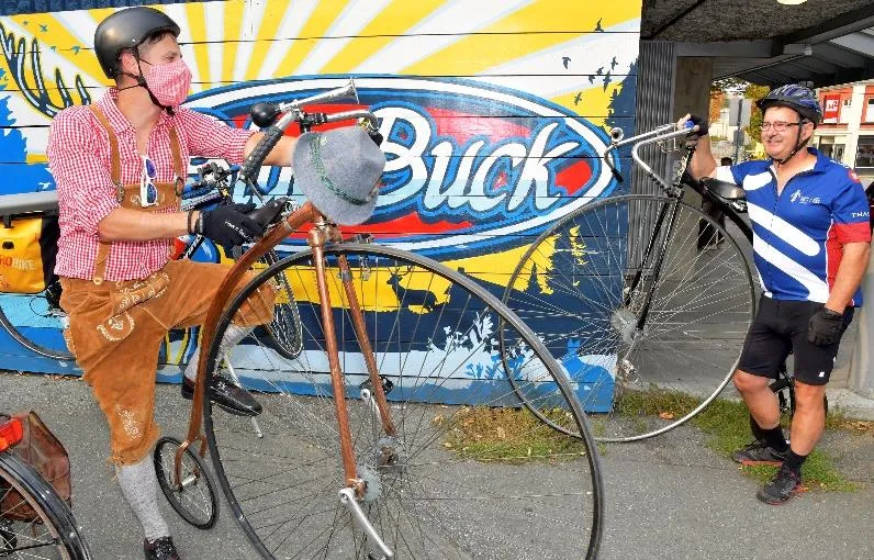 A cyclist with her bike at a celebration station