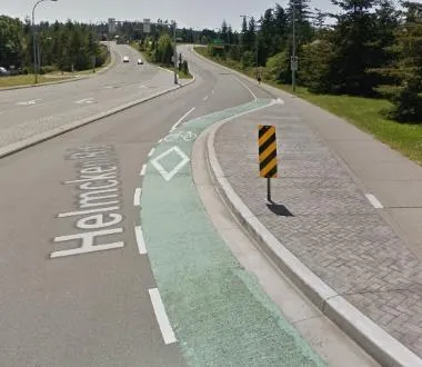 A curb extension on Helmcken Rd featuring a green-painted bicycle lane.
