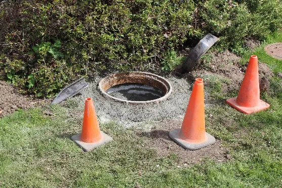 Raised sewer manhole at the end of Vickery Road