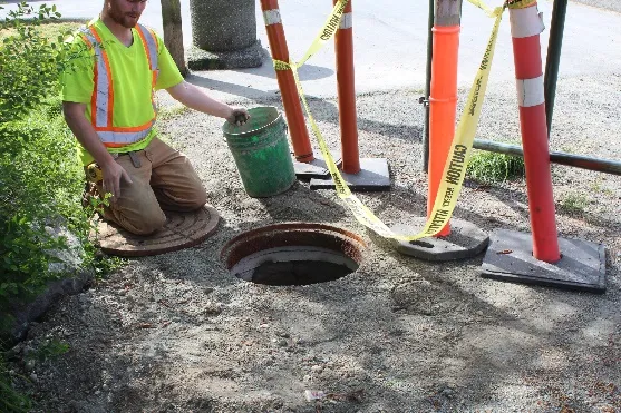Raised sewer manhole at the entrance to View Royal Park