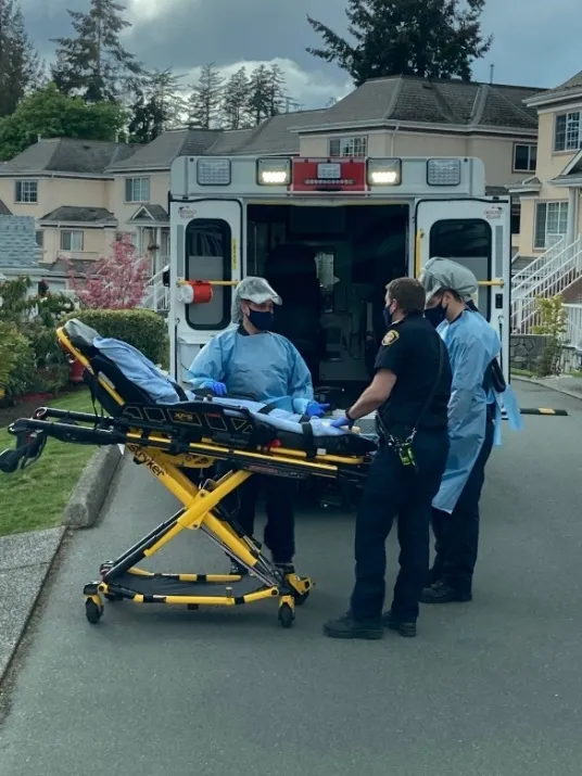 Emergency responders at an ambulance