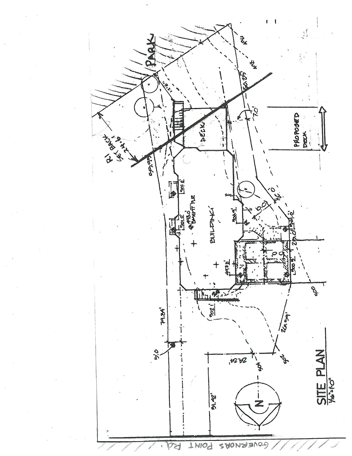 Hand-drawn site plan for a property located on Governors Point Road. The plan shows the footprint of a building, an existing deck, and a "Proposed Deck". It includes a north arrow, property line measurements (31.42', 79.84', etc.), and identifies an R1 Setback of 24.6' adjacent to an area labeled "Park".