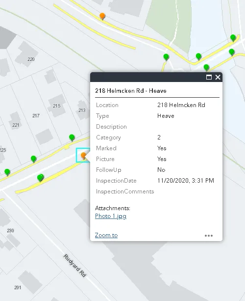 GIS inspection tool showing a pop-up for a sidewalk "Heave" at 218 Helmcken Rd with inspection details and photo attachment