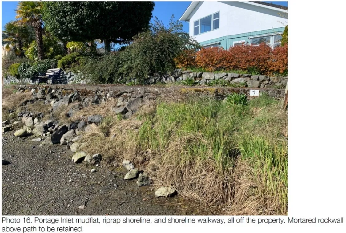 Photo showing Portage Inlet mudflat, riprap shoreline, and shoreline walkway