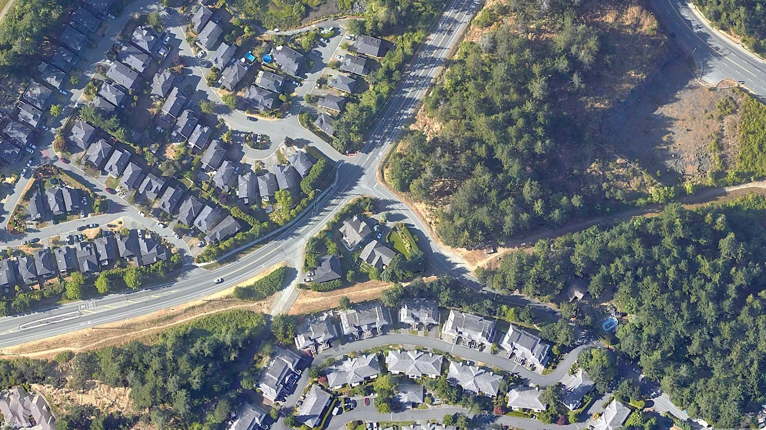 Aerial view of the Watkiss Way and Erskine Lane intersection area.