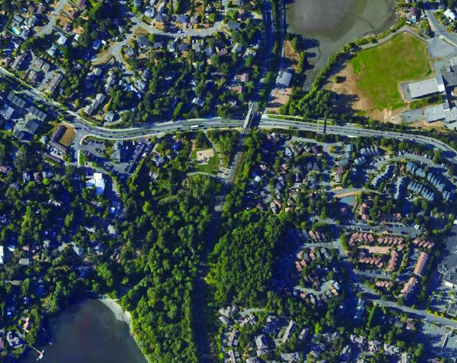 Aerial context plan showing the project site location in relation to Portage Inlet, Island Highway, Town Hall, Portage Park, and E&N Railway Trail