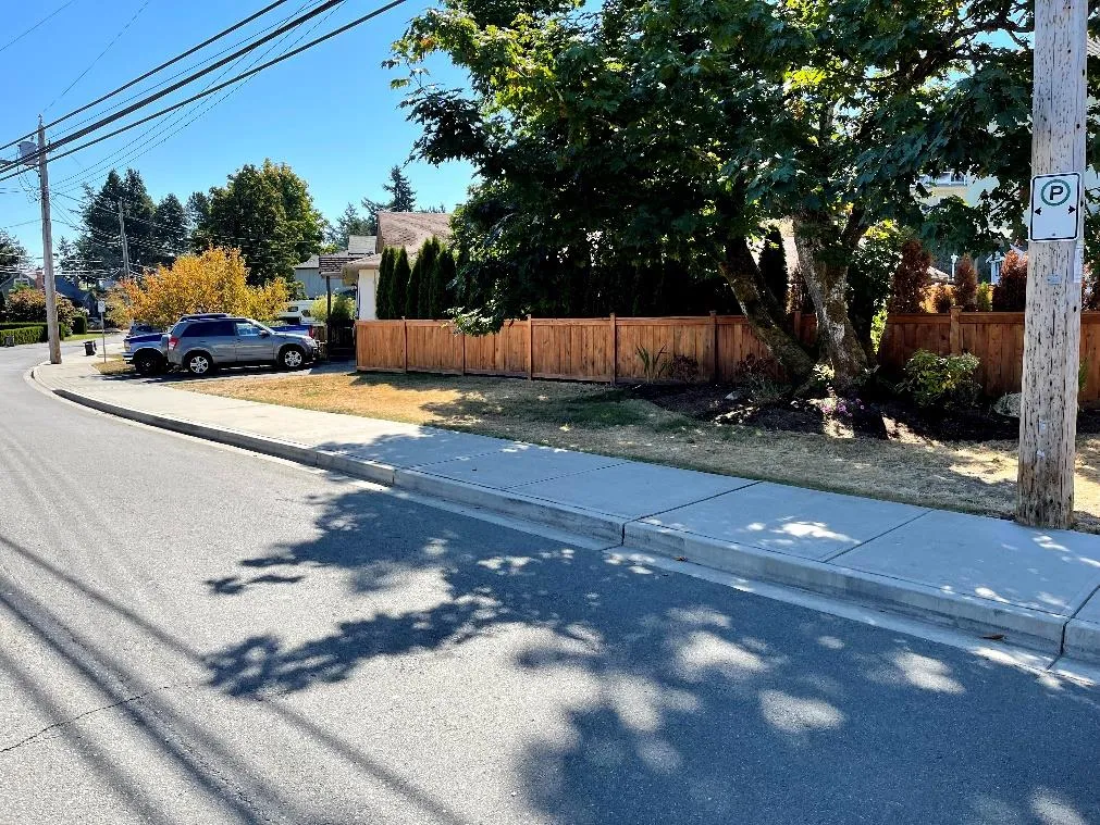 Existing parking allowed on Jedburgh Rd with a regulatory sign on a utility pole