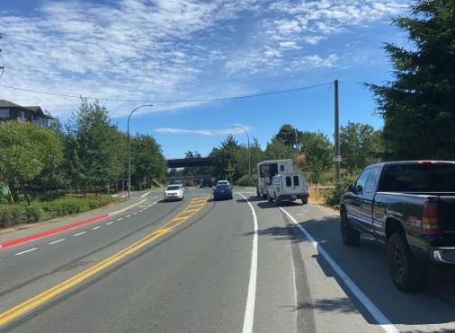 Zoomed-in view of the intersection showing a larger vehicle parked on the shoulder, potentially blocking a stop sign