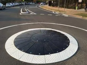 Example of a low-profile, modular temporary roundabout disc installed on a road surface