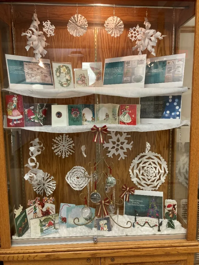 “Cards from Christmas Past” holiday display cabinet in the Town Hall foyer