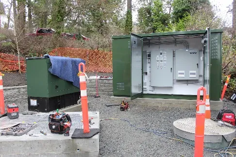 interior view of the new electrical control kiosk and adjacent generator on site