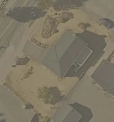 Aerial view showing site and immediate neighboring properties
