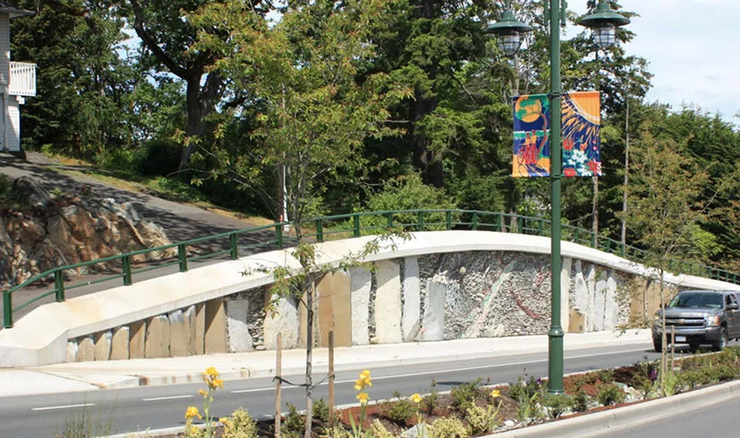 Stone wall art installation along a roadway