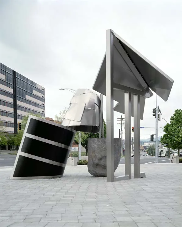 Large metallic modern sculpture "Pavilion, Rock and Shell" in an urban setting