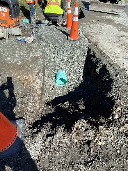 Replacement of steel culvert at Brian Place and Glenairlie Drive showing new pipe installation in trench