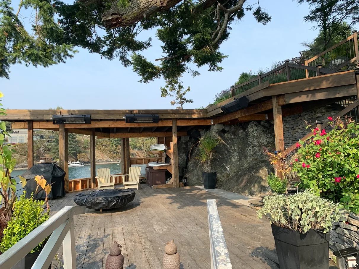 Photo 4. Storage shed is being constructed within the footprint of the previously constructed area: an existing dock, concrete pad, previously cleared bedrock, and stacked rock wall, within the SDPA.