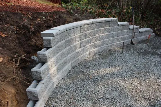 Newly installed stacked brick retaining wall at Thetis Cove Pump Station