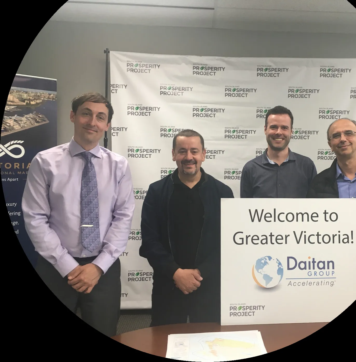 Group of four men at a "Welcome to Greater Victoria!" event for the Daitan Group