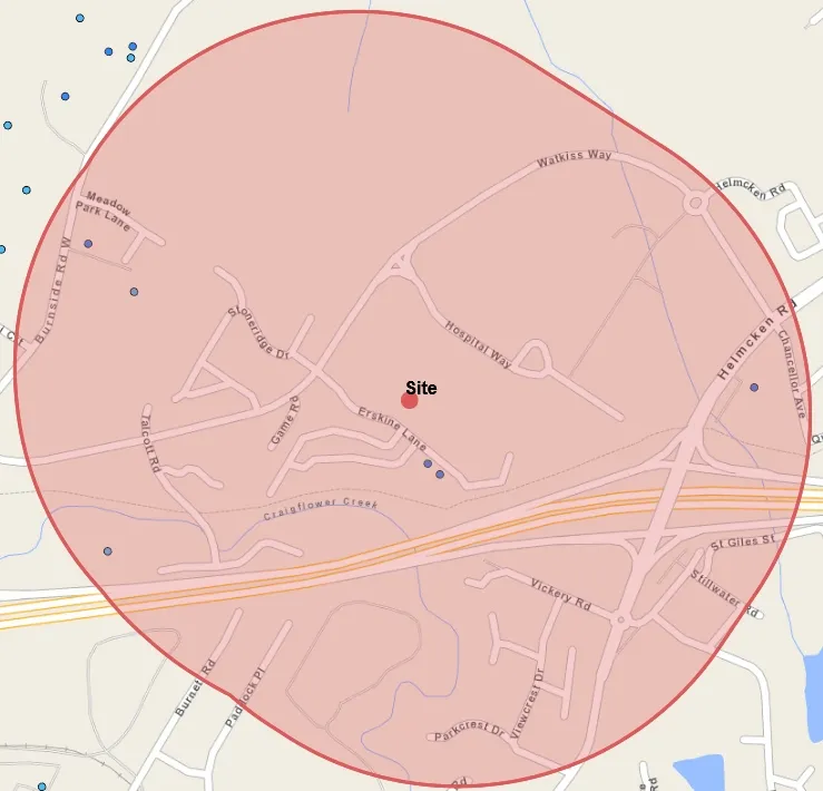 Regional map showing a 'Site' location with a red circular buffer, nearby roads including Burnside Rd W, Watkiss Way, and Helmcken Rd, and various water well indicators.