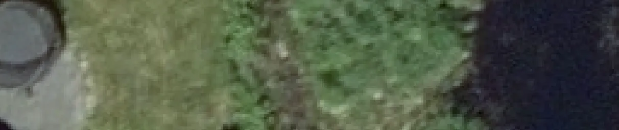 Aerial view crop of a trampoline located in a yard