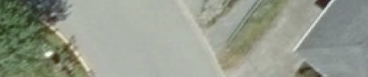 Aerial view crop of a street and property boundary edge